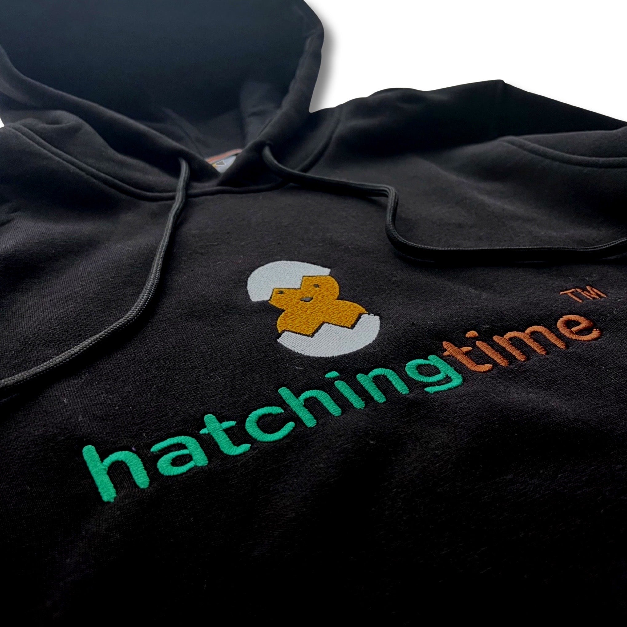 HatchingTime Hoodie Black Front Logo Closeup