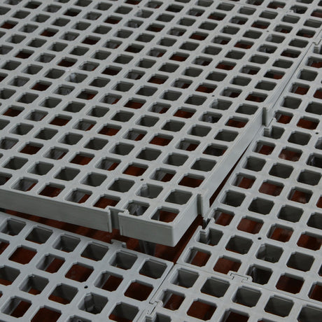 Hatching Time Cimuka. Slat flooring is seen with slots being lined up for assembly.