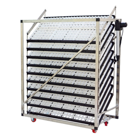 Hatching Time Cimuka. Egg setter trays on trolleys. Motor can be seen on side of trolley for egg turning.