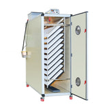 Hatching Time Cimuka. T2400S image shows incubator with open door with setting trays inside. Humidity Tray can be seen on floor of incubator. Digital control on top of incubator is in front of water reservoir tank connected to Humisonic Humidifier.