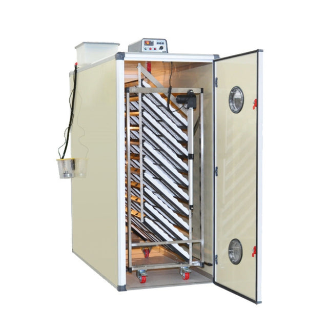 Hatching Time Cimuka. T2400SH Incubator can be seen with door open to capacity of incubator. Digital control can be seen on top of incubator. Water reservoir tank can be seen behind control and connected to Humisonic humidifier.