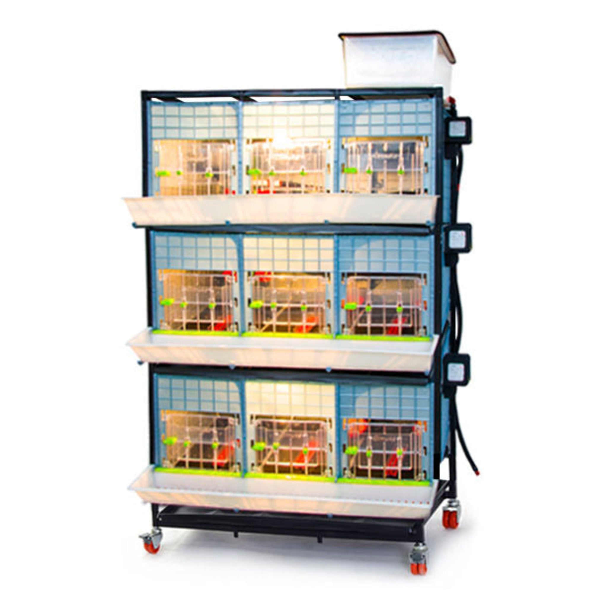 Hatching Time Cimuka 3 Layer 15 Inch Brooder front visible with LED light on. Feeding trough is located on front of brooders. Clear plastic doors with locks can be seen. Heater thermostat visible on side of brooders. Brooders are on Metal frame with rolling casters for mobility.